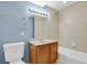 Bright bathroom features a vanity with a light countertop and a bathtub with tiled wall at 5521 S Yakima St, Aurora, CO 80015