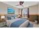 Cozy bedroom with a decorative fan and ocean-themed accents at 5521 S Yakima St, Aurora, CO 80015