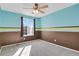Bedroom showing window with natural light and two-tone color scheme at 5521 S Yakima St, Aurora, CO 80015