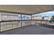 Enjoy neighborhood views from this property's covered deck with rail and wood plank floor at 5521 S Yakima St, Aurora, CO 80015