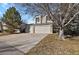 Inviting two-story home features a three car garage and a long driveway at 5521 S Yakima St, Aurora, CO 80015