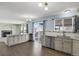 Bright kitchen featuring wooden cabinets, stainless steel appliances, and hardwood floors at 5521 S Yakima St, Aurora, CO 80015