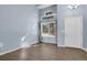 Bright living room with large windows, high ceiling, and beautiful wood floors at 5521 S Yakima St, Aurora, CO 80015