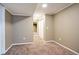 Carpeted bedroom with neutral walls, recessed lighting, and a view of a hallway with closet at 8791 Starwood Ln, Parker, CO 80134