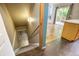 View of the front doorway, stairs to the basement, and an entry into the living room at 8791 Starwood Ln, Parker, CO 80134