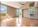 Spacious living room with hardwood floors, high ceilings, and lots of natural light from several windows at 8791 Starwood Ln, Parker, CO 80134