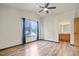 Spacious main bedroom with vaulted ceilings, a ceiling fan, wood floors, and an ensuite bathroom at 8791 Starwood Ln, Parker, CO 80134