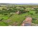 Extensive aerial view displays horse property with ample land, equestrian facilities, and surrounding landscapes at 3850 Hopi Dr, Sedalia, CO 80135