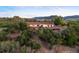 Aerial view of the beautiful home nestled in a lush, green landscape at 3850 Hopi Dr, Sedalia, CO 80135