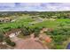Aerial view of property with house, horse paddock, outbuildings, and surrounding trees at 3850 Hopi Dr, Sedalia, CO 80135