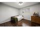 Bedroom with hardwood floors, natural light, and a side table with horse artwork at 3850 Hopi Dr, Sedalia, CO 80135