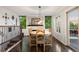 Dining room featuring wood floors, a fireplace, and natural lighting with views of outdoors at 3850 Hopi Dr, Sedalia, CO 80135