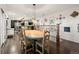 Dining room featuring wood floors, a rustic table, and a decorative rail at 3850 Hopi Dr, Sedalia, CO 80135