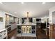 Well-appointed kitchen with stainless steel appliances, an island, wine storage, and ample counter space for entertaining at 3850 Hopi Dr, Sedalia, CO 80135
