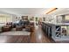 An open floor plan with a bar seating area and a cozy fireplace in the living area at 3850 Hopi Dr, Sedalia, CO 80135