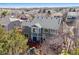 Birds-eye view of backyard featuring an elevated red deck, with many trees, bushes, and a large backyard at 474 Rose Finch Cir, Highlands Ranch, CO 80129
