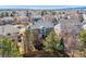 Beautiful aerial view of the house surrounded by trees, with great landscaping and a fenced backyard at 474 Rose Finch Cir, Highlands Ranch, CO 80129