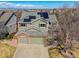 Stunning aerial view of the house with solar panels, attached garage, and mature landscaping at 474 Rose Finch Cir, Highlands Ranch, CO 80129