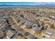 Expansive aerial view of the neighborhood with stunning mountain views in the distance and neighborhood solar panels at 474 Rose Finch Cir, Highlands Ranch, CO 80129