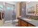 Updated bathroom with a tiled shower, and modern vanity with sleek fixtures and neutral colors at 474 Rose Finch Cir, Highlands Ranch, CO 80129