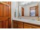 Bathroom featuring a double vanity, framed mirror, and a shower with a curtain at 474 Rose Finch Cir, Highlands Ranch, CO 80129