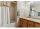 Bathroom showcasing a single sink vanity, tiled shower, and neutral color palette at 474 Rose Finch Cir, Highlands Ranch, CO 80129