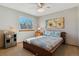 Cozy bedroom features a comfy bed, a nearby window for natural light, and a bedside table at 474 Rose Finch Cir, Highlands Ranch, CO 80129