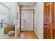Inviting entryway with hardwood floors, a decorative front door, and a view into the adjacent living space at 474 Rose Finch Cir, Highlands Ranch, CO 80129