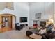 Spacious living room featuring a fireplace, media center, comfortable seating and lots of light at 474 Rose Finch Cir, Highlands Ranch, CO 80129