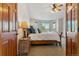 Main bedroom with a king bed, and a bay window providing bright natural light and space at 474 Rose Finch Cir, Highlands Ranch, CO 80129