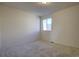 Bright bedroom features a large window and carpeted floors at 16357 E 111Th Pl, Commerce City, CO 80022