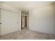 Neutral bedroom featuring double closet with ample storage space, light-colored carpet, and minimalist design at 16357 E 111Th Pl, Commerce City, CO 80022