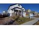 Two-story home featuring stone accents, a welcoming front porch, and a two-car garage at 16357 E 111Th Pl, Commerce City, CO 80022