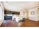 Bright kitchen featuring an island with seating, modern appliances, and ample cabinet space at 16357 E 111Th Pl, Commerce City, CO 80022