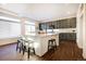 Spacious kitchen featuring a large island with barstool seating and modern appliances at 16357 E 111Th Pl, Commerce City, CO 80022