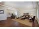 Open-concept living room and dining area with modern decor and ample natural light at 16357 E 111Th Pl, Commerce City, CO 80022