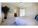 Cozy bedroom with bed and plant; access to bathroom at 16357 E 111Th Pl, Commerce City, CO 80022