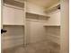Large walk-in closet with shelving units and carpeted floor at 16357 E 111Th Pl, Commerce City, CO 80022