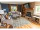 Living room with sectional sofa and built-in shelving at 11100 Yarrow St, Broomfield, CO 80021