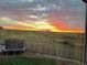 Backyard view features a beautiful sunset and a trampoline at 11100 Yarrow St, Broomfield, CO 80021