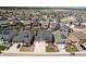 Aerial view of a well-planned community showcasing multiple homes, green spaces, and landscaping at 141 Back Nine Dr, Castle Pines, CO 80108