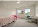 Bright room with pink accents, including a pink bed and a pink beanbag chair for a fun experience at 141 Back Nine Dr, Castle Pines, CO 80108