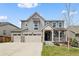 Charming two-story home with a three-car garage and inviting covered porch, perfect for suburban living at 141 Back Nine Dr, Castle Pines, CO 80108