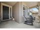 Cozy front porch featuring comfortable seating, perfect for relaxing and enjoying the neighborhood view at 141 Back Nine Dr, Castle Pines, CO 80108