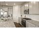 Well-appointed kitchen featuring granite countertops, stainless steel appliances, and ample cabinet space for storage at 141 Back Nine Dr, Castle Pines, CO 80108