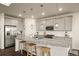 Modern kitchen with stainless steel appliances, granite countertops, pendant lighting, and spacious island with seating at 141 Back Nine Dr, Castle Pines, CO 80108