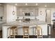 Spacious kitchen with an oversized island, modern appliances, ample counter space, and stylish pendant lighting at 141 Back Nine Dr, Castle Pines, CO 80108