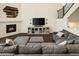 Spacious living room features fireplace, modern decor, and a comfortable sectional sofa at 141 Back Nine Dr, Castle Pines, CO 80108