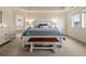 Relaxing main bedroom featuring a tray ceiling, natural light, and serene colors at 141 Back Nine Dr, Castle Pines, CO 80108