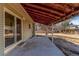 Covered patio off the home's exterior with concrete floor at 14703 E Caspian Pl, Aurora, CO 80014